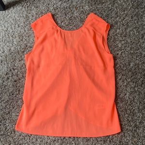 bright neon orange express top. open/ bow on back